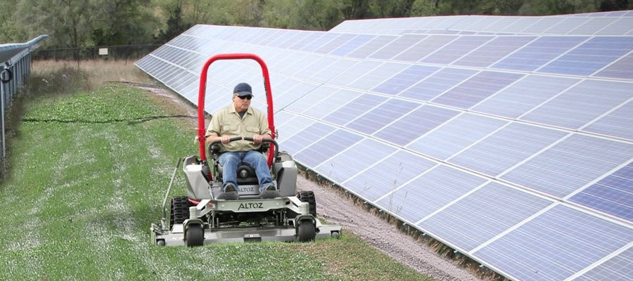 Tracked zero turn mower at solar farm