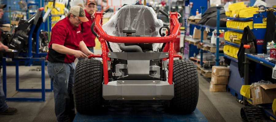 lawn mower on assembly line
